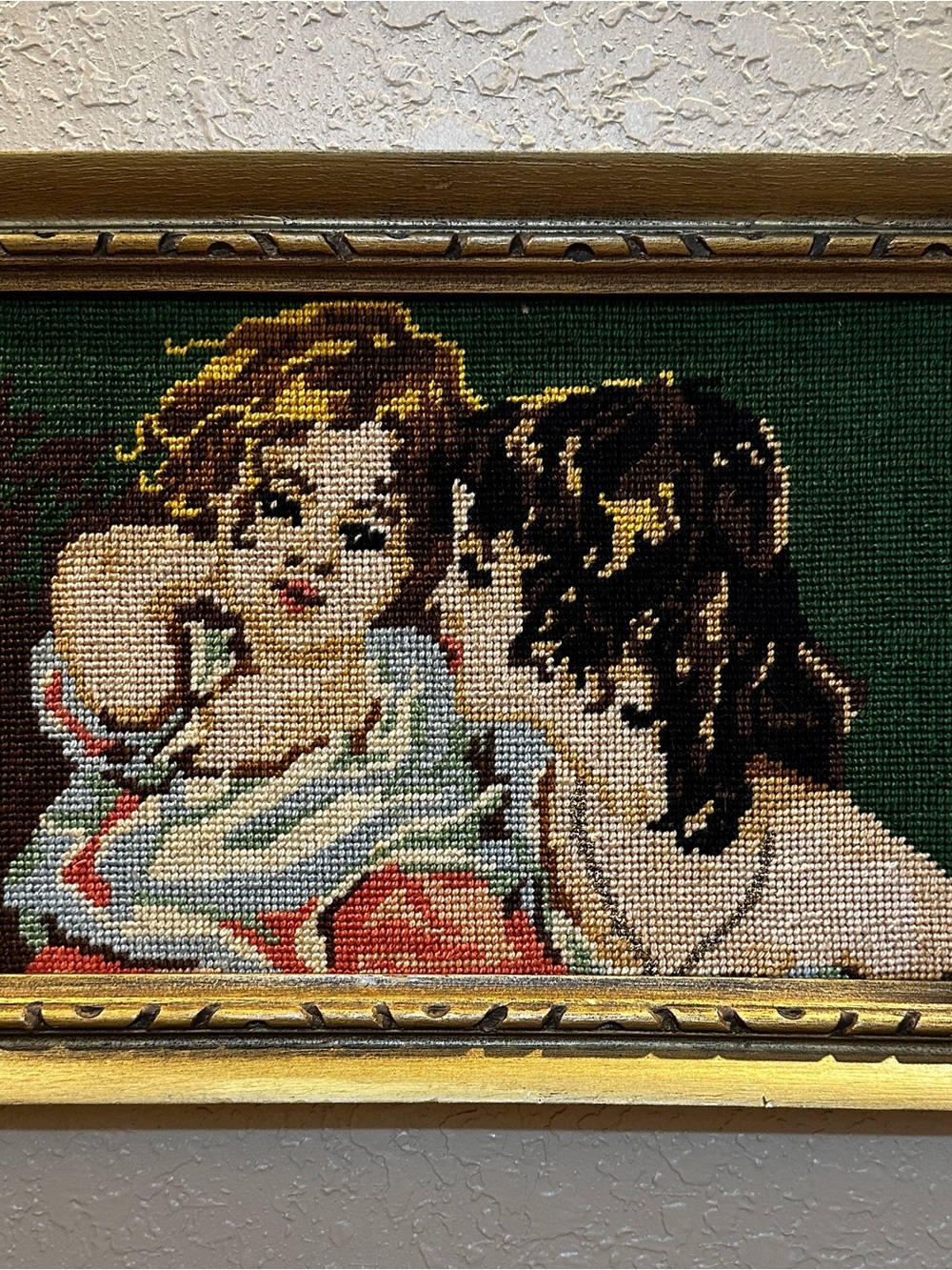 Vintage framed needlepoint tapestry depicting a classic mother-and-child